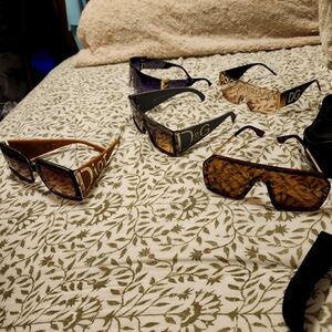 Two pair of dolce & Gabbana sunglasses, to pair of Fendi sunglasses, and Dior